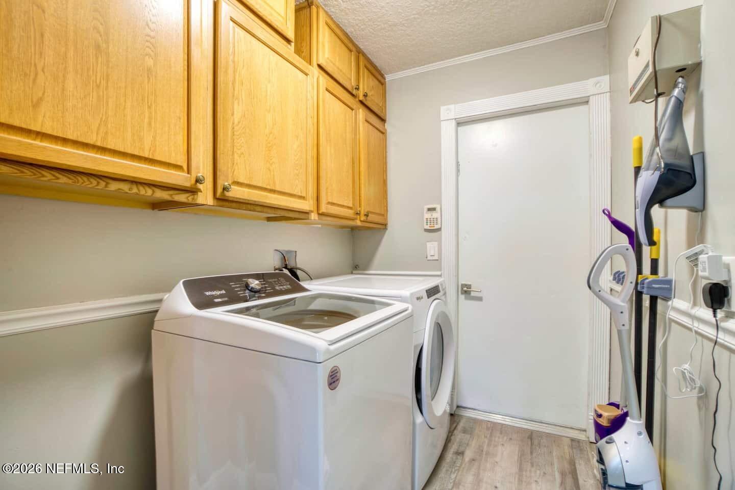 11613 Lake Ride Drive Jacksonville, FL 32223 - Photo 31 of 42 a utility room with dryer and washer