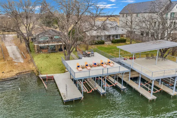 an aerial view of a house with swimming pool garden and mountain view