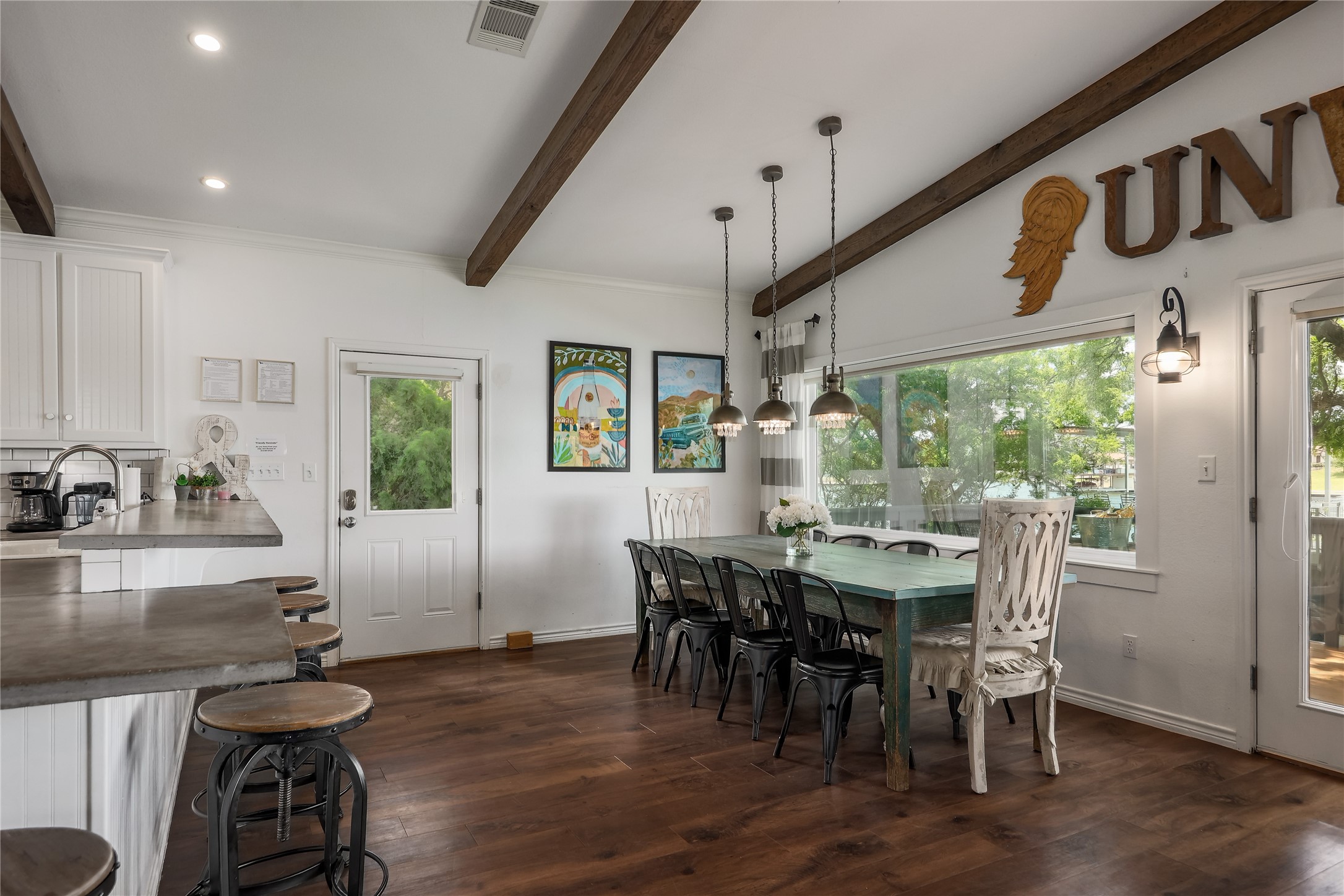 525 Ellen Williams Loop Kingsland, TX 78639 - Photo 20 of 36 a view of a dining room with furniture window and wooden floor