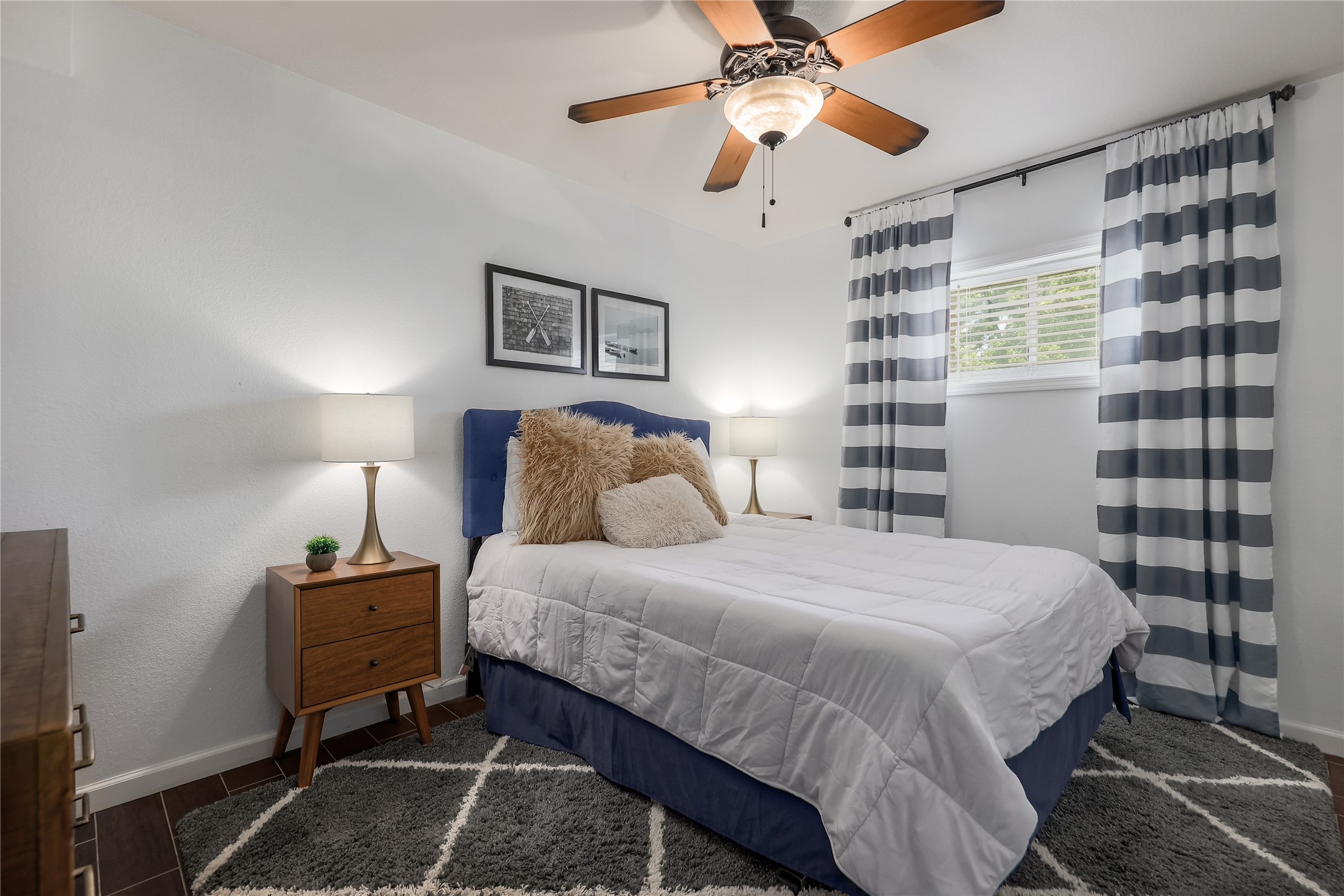 525 Ellen Williams Loop Kingsland, TX 78639 - Photo 30 of 36 a bedroom with a bed and a chandelier