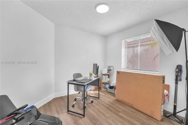 a workspace with furniture and a window