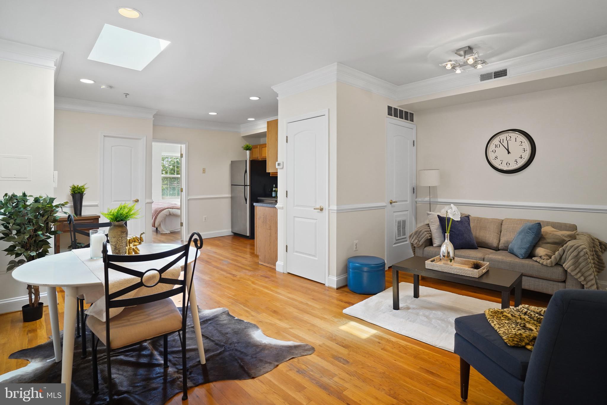 435 Kennedy Street Northwest, Unit 3 Washington, DC 20011 - Photo 2 of 13 a living room with furniture and wooden floor