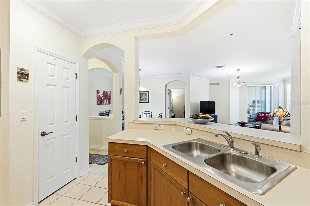 8180 Boat Hook Loop, Unit 304 Windermere, FL 34786 - Photo 13 of 38 a view of a kitchen sink a faucet a fireplace and a view of living room