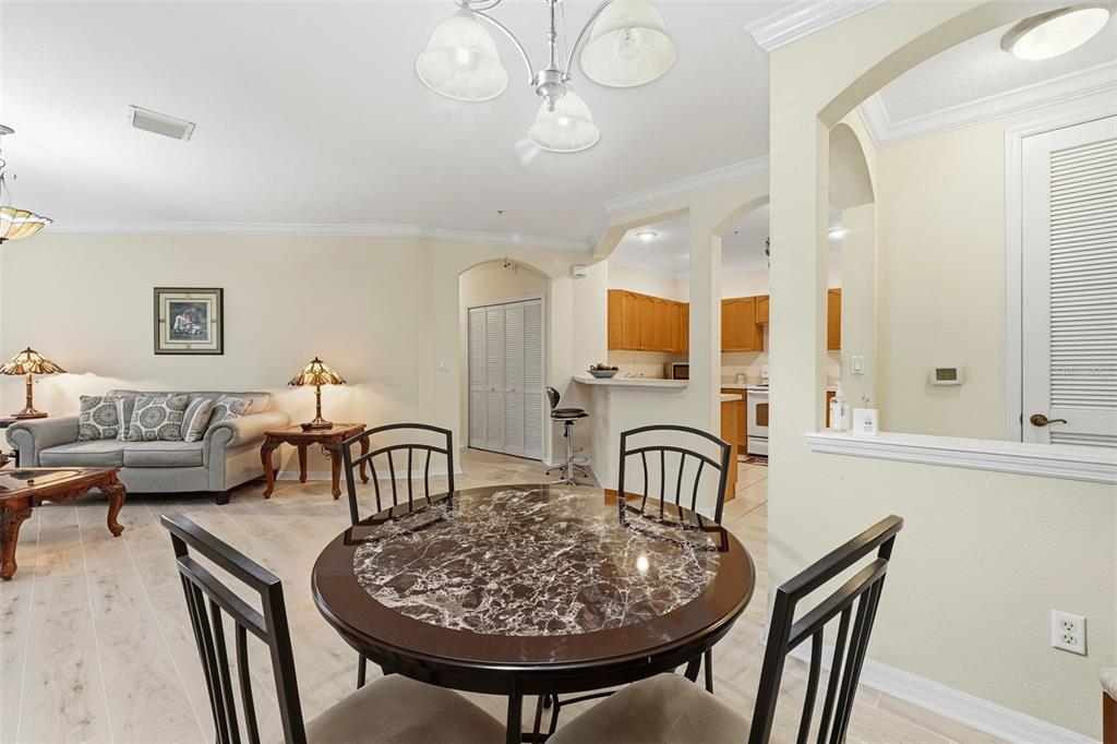 8180 Boat Hook Loop, Unit 304 Windermere, FL 34786 - Photo 16 of 38 a view of a a dining room with furniture window and wooden floor