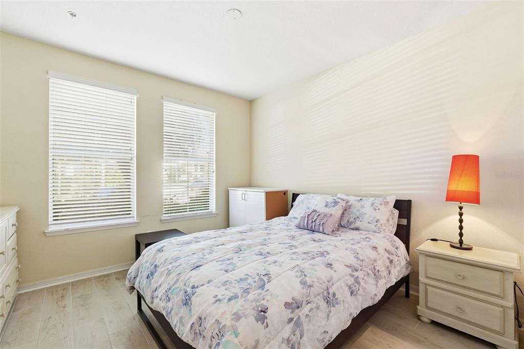 8180 Boat Hook Loop, Unit 304 Windermere, FL 34786 - Photo 25 of 38 a bedroom with a bed and a window