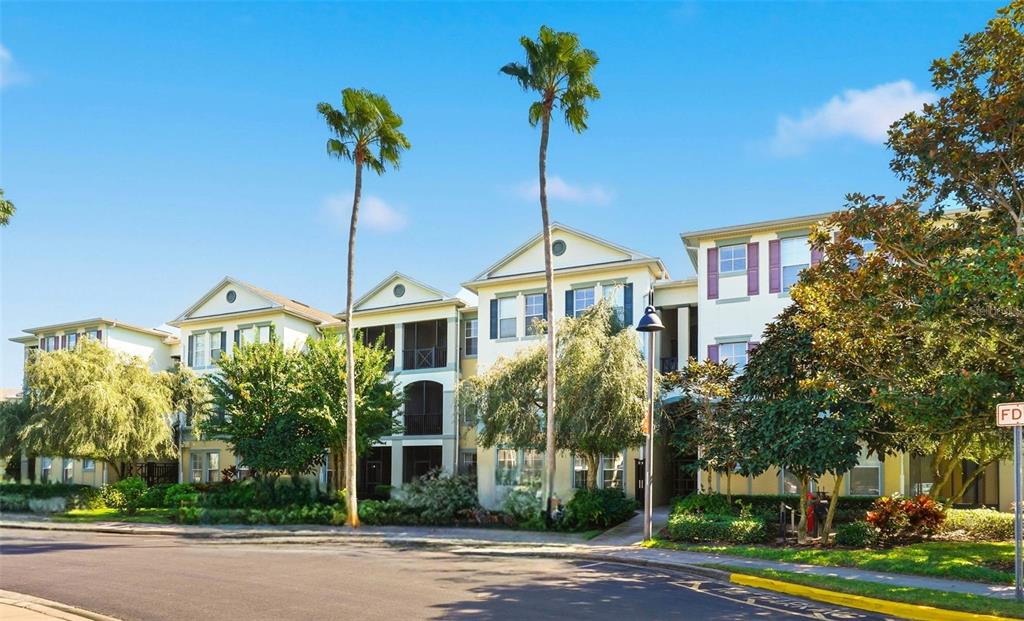 8180 Boat Hook Loop, Unit 304 Windermere, FL 34786 - Photo 3 of 38 a front view of a house with a garden