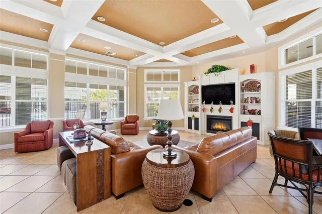 a living room with fireplace furniture and a flat screen tv