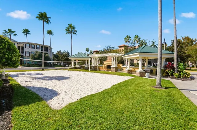 a view of a house with swimming pool and a yard