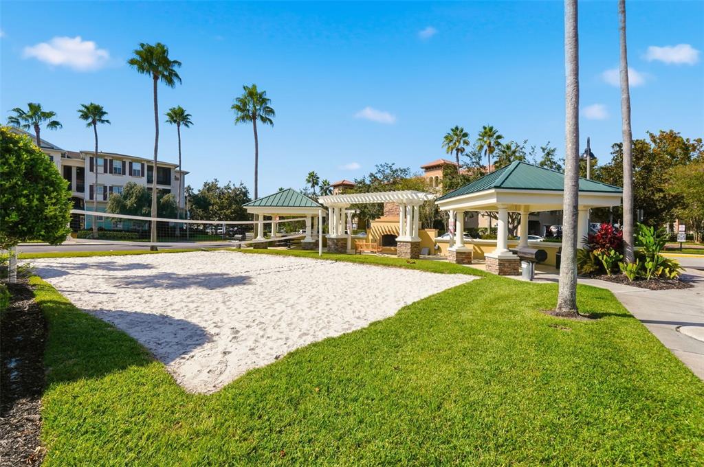 8180 Boat Hook Loop, Unit 304 Windermere, FL 34786 - Photo 36 of 38 a view of a house with swimming pool and a yard