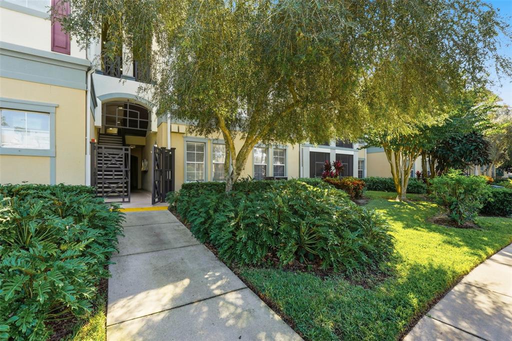 8180 Boat Hook Loop, Unit 304 Windermere, FL 34786 - Photo 5 of 38 a front view of a house with a garden