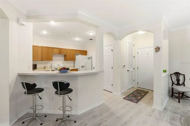a kitchen with a sink cabinets and appliances
