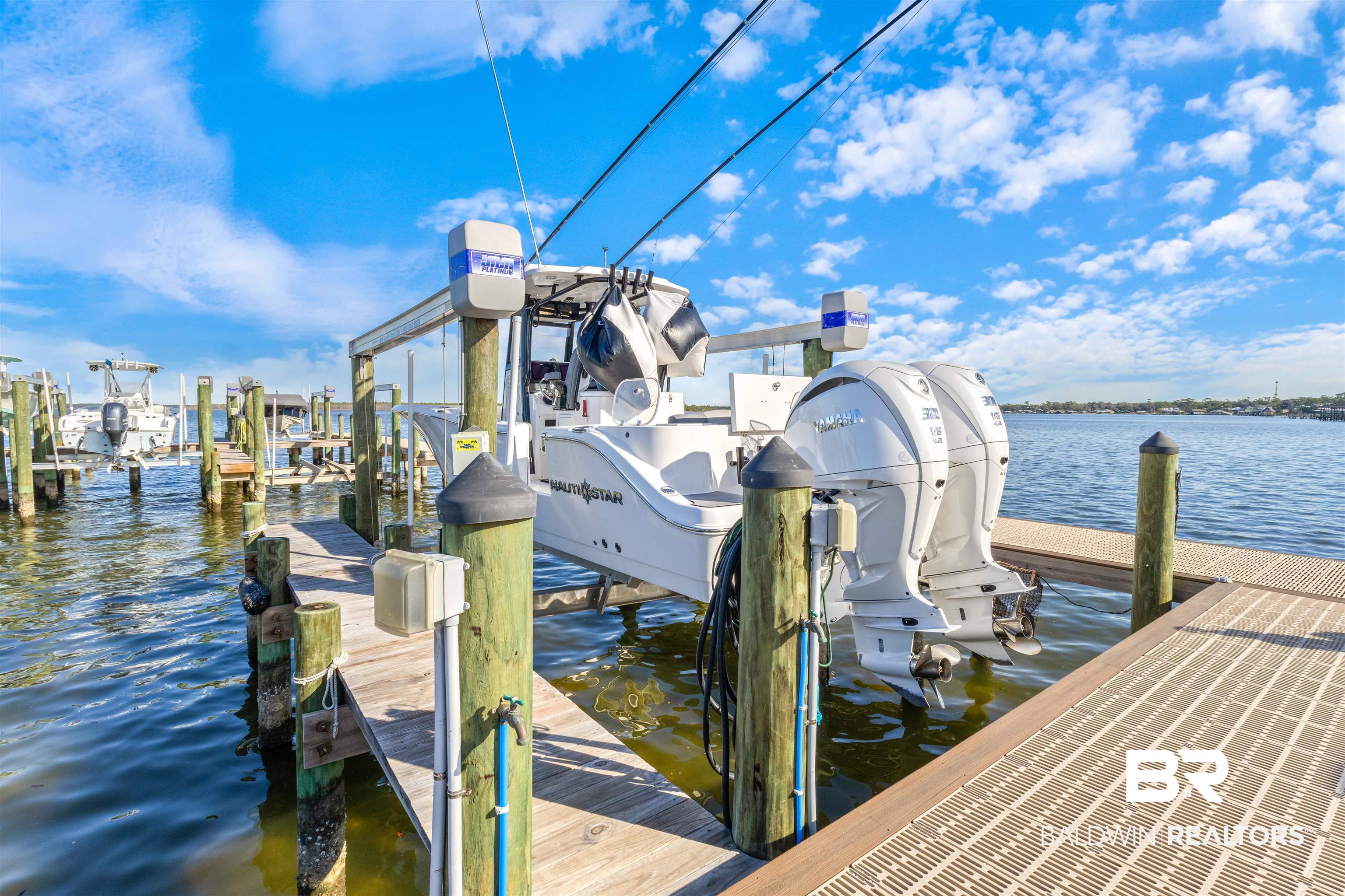 25861 Canal Road, Unit 3 Orange Beach, AL 36561 - Photo 31 of 40 Dock area featuring boat lift and a water view