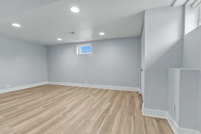 a view of room with wooden floor and fan