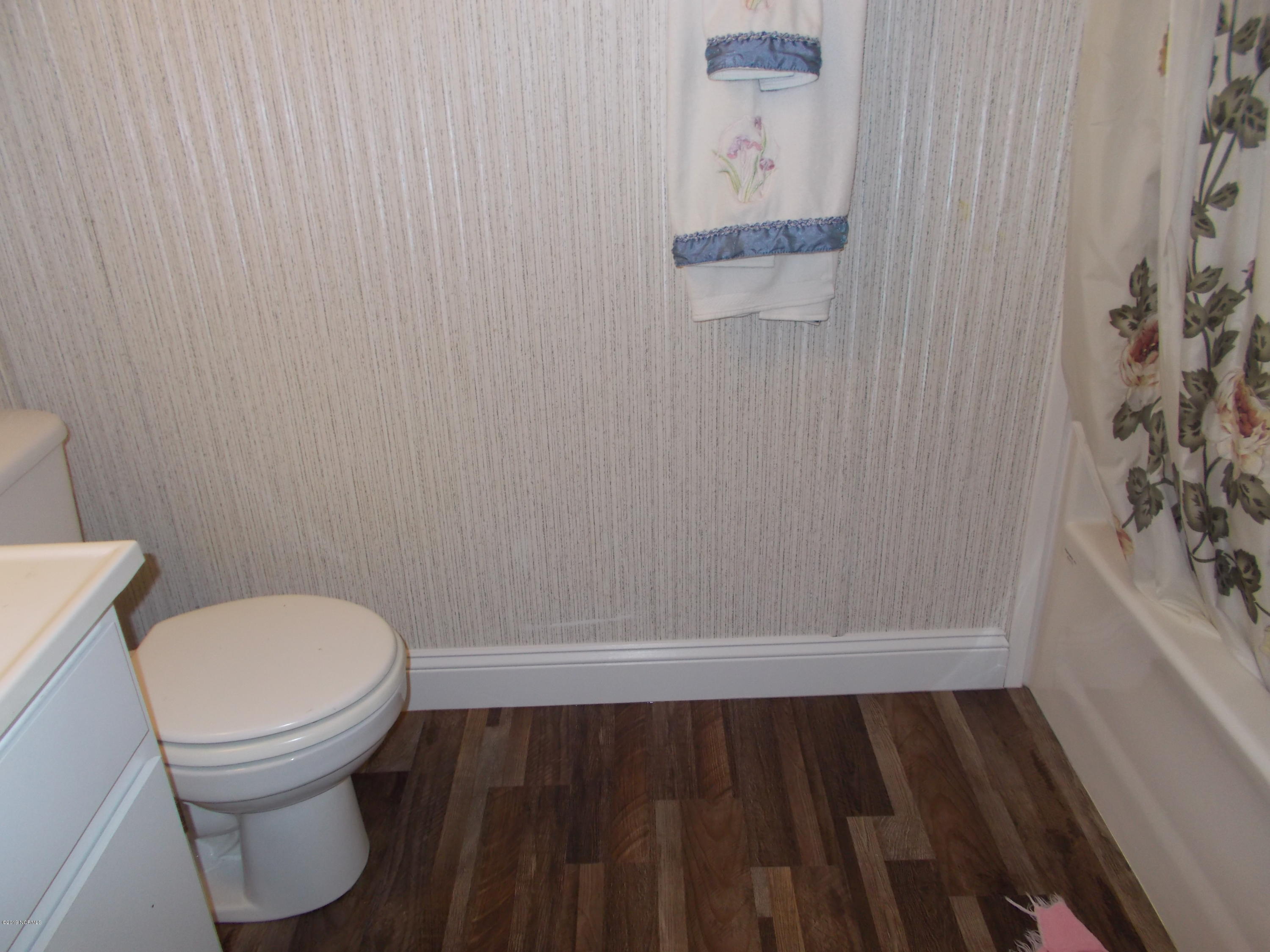 2384 Seashore Road Southwest Supply, NC 28462 - Photo 20 of 29 New flooring in bath.