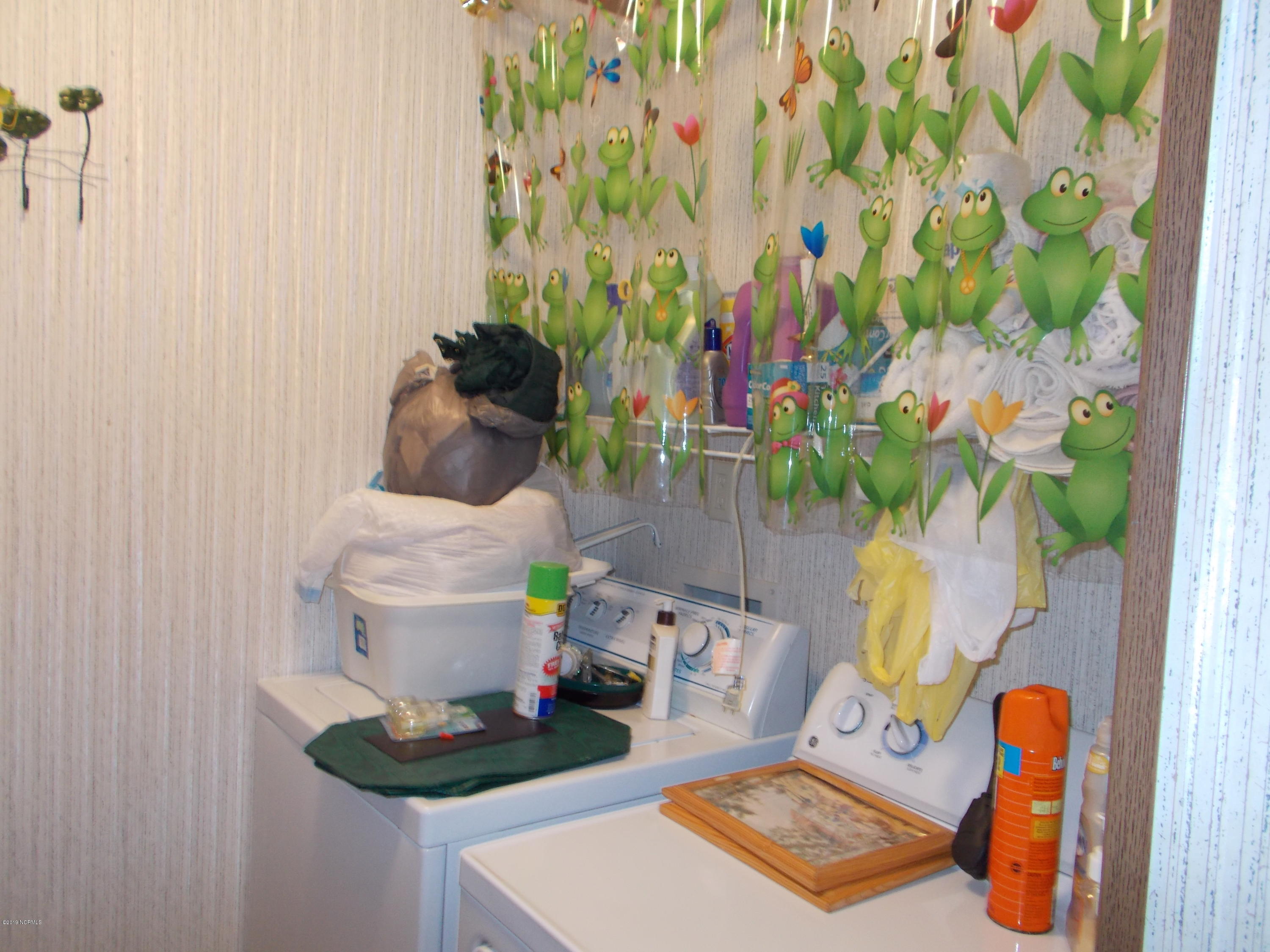 2384 Seashore Road Southwest Supply, NC 28462 - Photo 27 of 29 Separate utility room adjacent to kitchen.