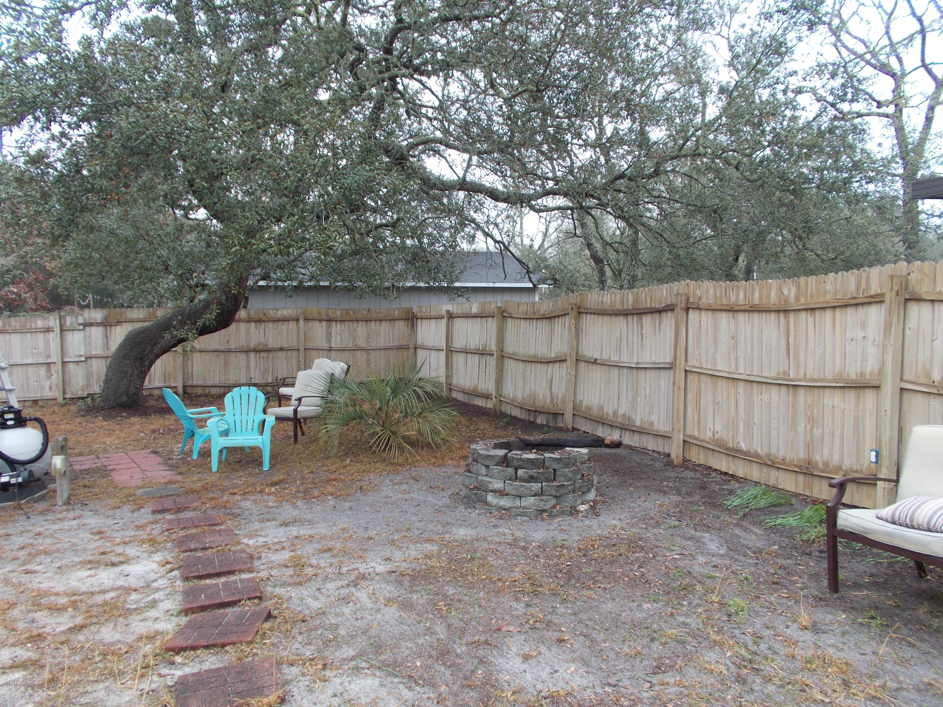 2384 Seashore Road Southwest Supply, NC 28462 - Photo 28 of 29 Private back yard with beautiful trees.