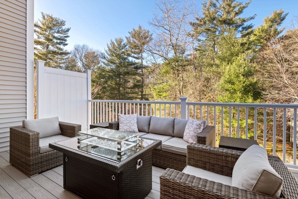 101 Tussock Brook Road, Unit 101 Duxbury, MA 02332 - Photo 14 of 38 a roof deck with couches and wooden floor