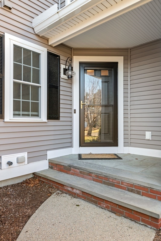 101 Tussock Brook Road, Unit 101 Duxbury, MA 02332 - Photo 2 of 38 a front view of a house