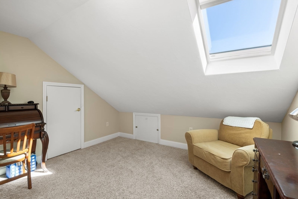 101 Tussock Brook Road, Unit 101 Duxbury, MA 02332 - Photo 25 of 38 a living room with furniture