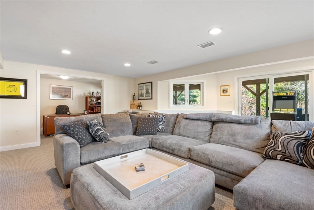 101 Tussock Brook Road, Unit 101 Duxbury, MA 02332 - Photo 29 of 38 a living room with furniture and a large window