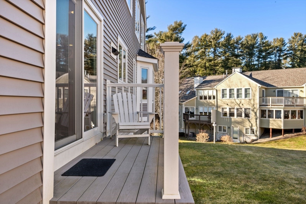 101 Tussock Brook Road, Unit 101 Duxbury, MA 02332 - Photo 6 of 38 a front view of a house with a yard
