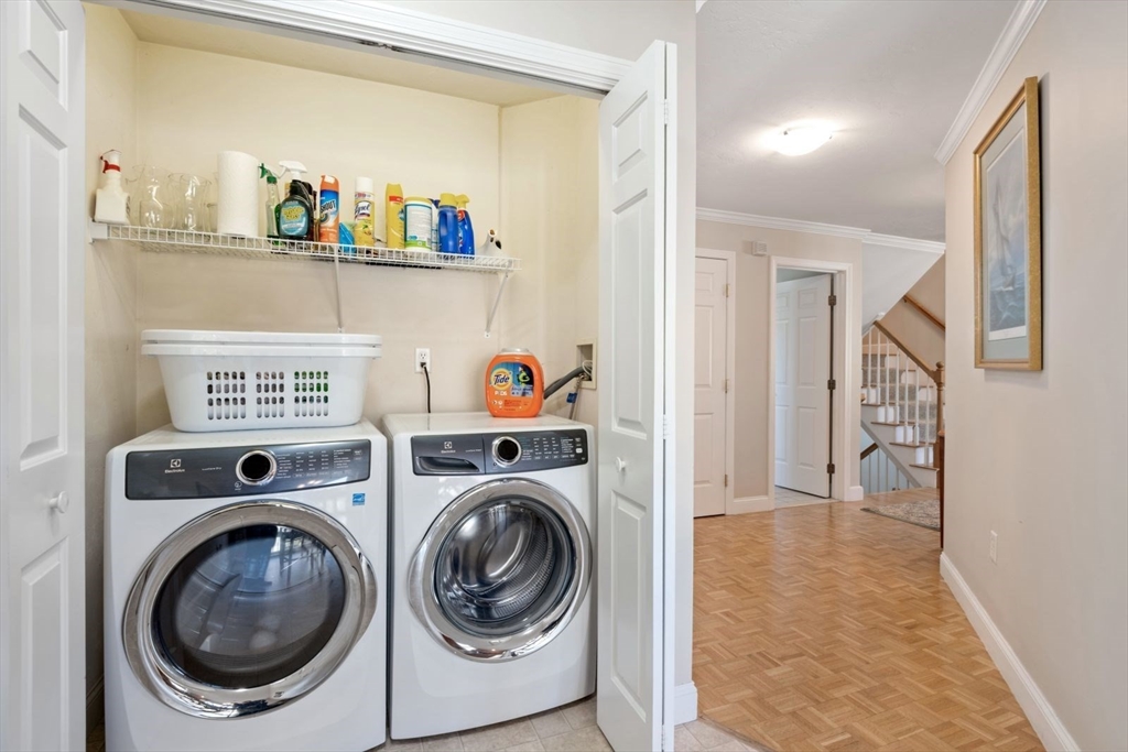 101 Tussock Brook Road, Unit 101 Duxbury, MA 02332 - Photo 7 of 38 a view of washer and dryer in a utility room