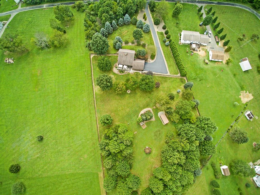 31 Stinedurf Road West Middlesex, PA 16159 - Photo 4 of 25 Relax and enjoy nature on your 40 x12 deck. The backyard includes a fun fire pit, dog kennel and 20x10 shed for all your outdoor tools and additional storage needs.