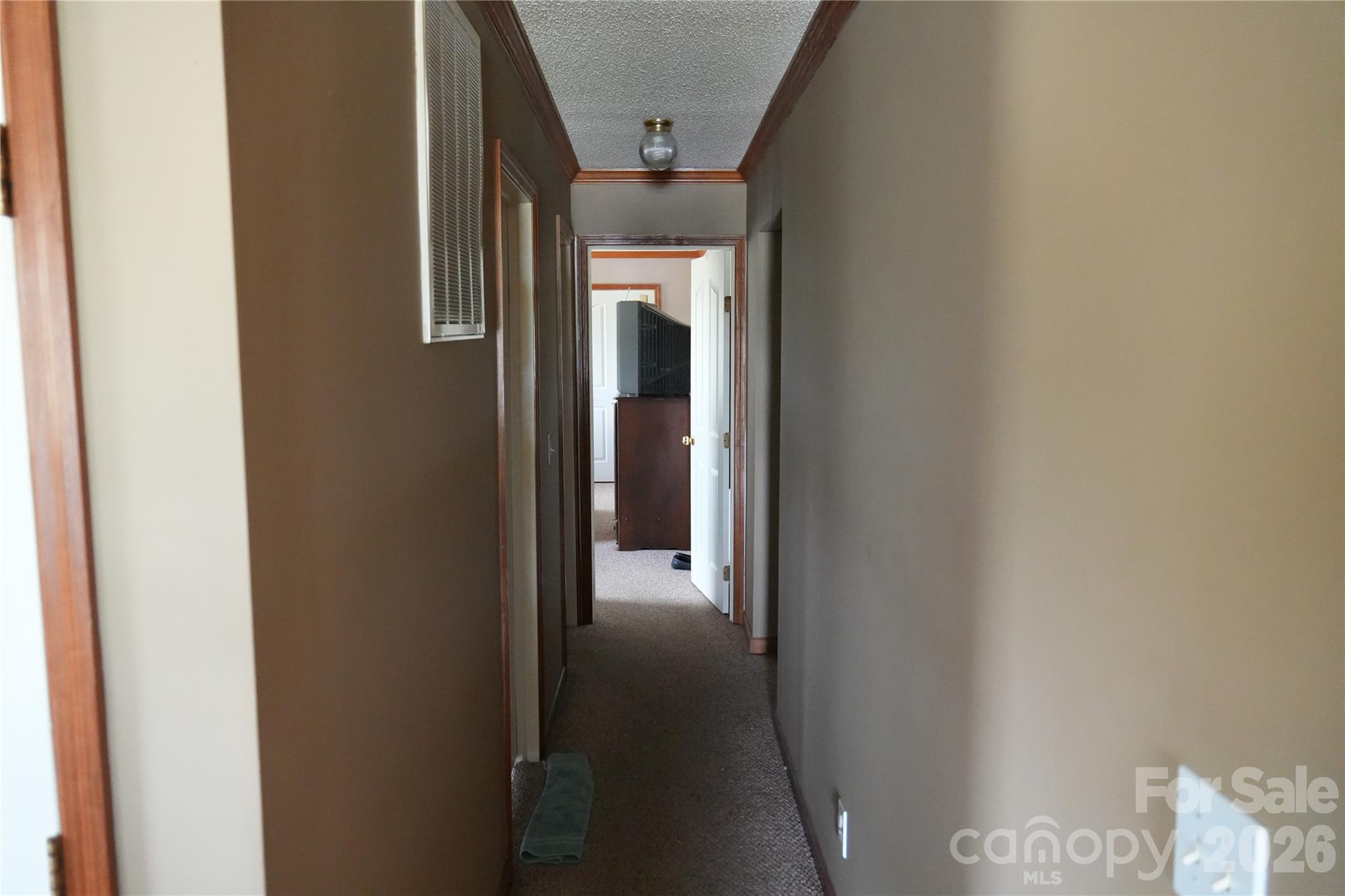 424 Press Walters Road Hartsville, SC 29550 - Photo 7 of 10 a view of a hallway with wooden shelves