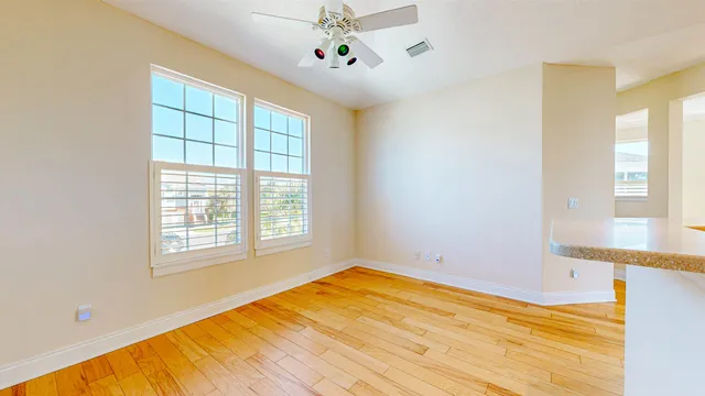 a view of a dining room with furniture window and outside view