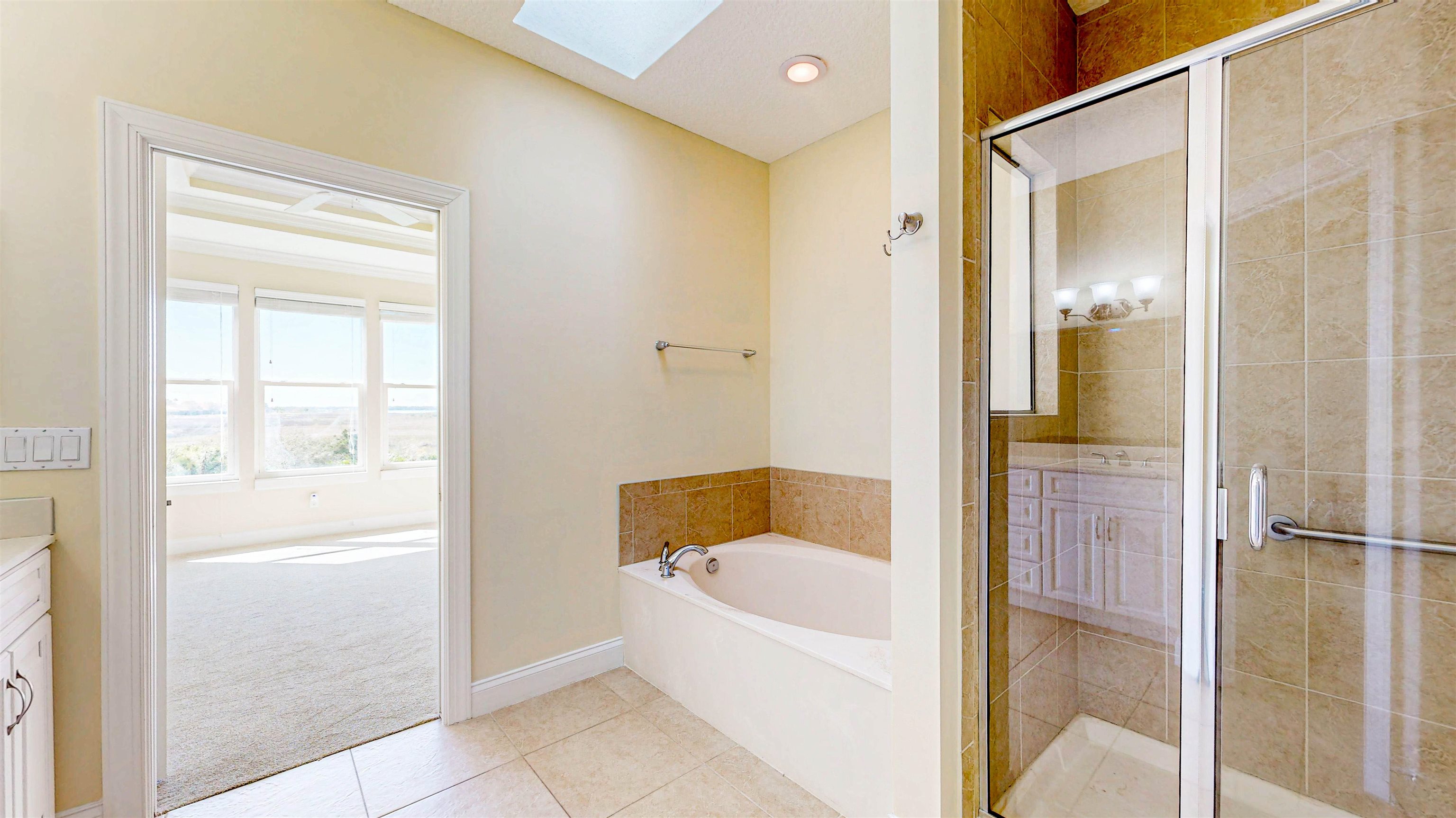 213 Sunset Point St. Augustine, FL 32080 - Photo 18 of 37 a bathroom with a tub shower and sink