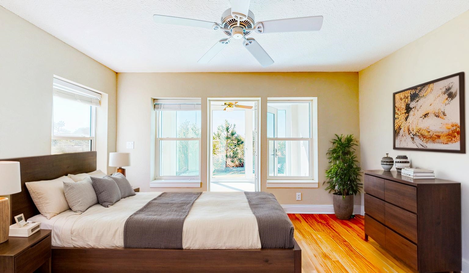 213 Sunset Point St. Augustine, FL 32080 - Photo 21 of 37 a bedroom with a large bed and a window