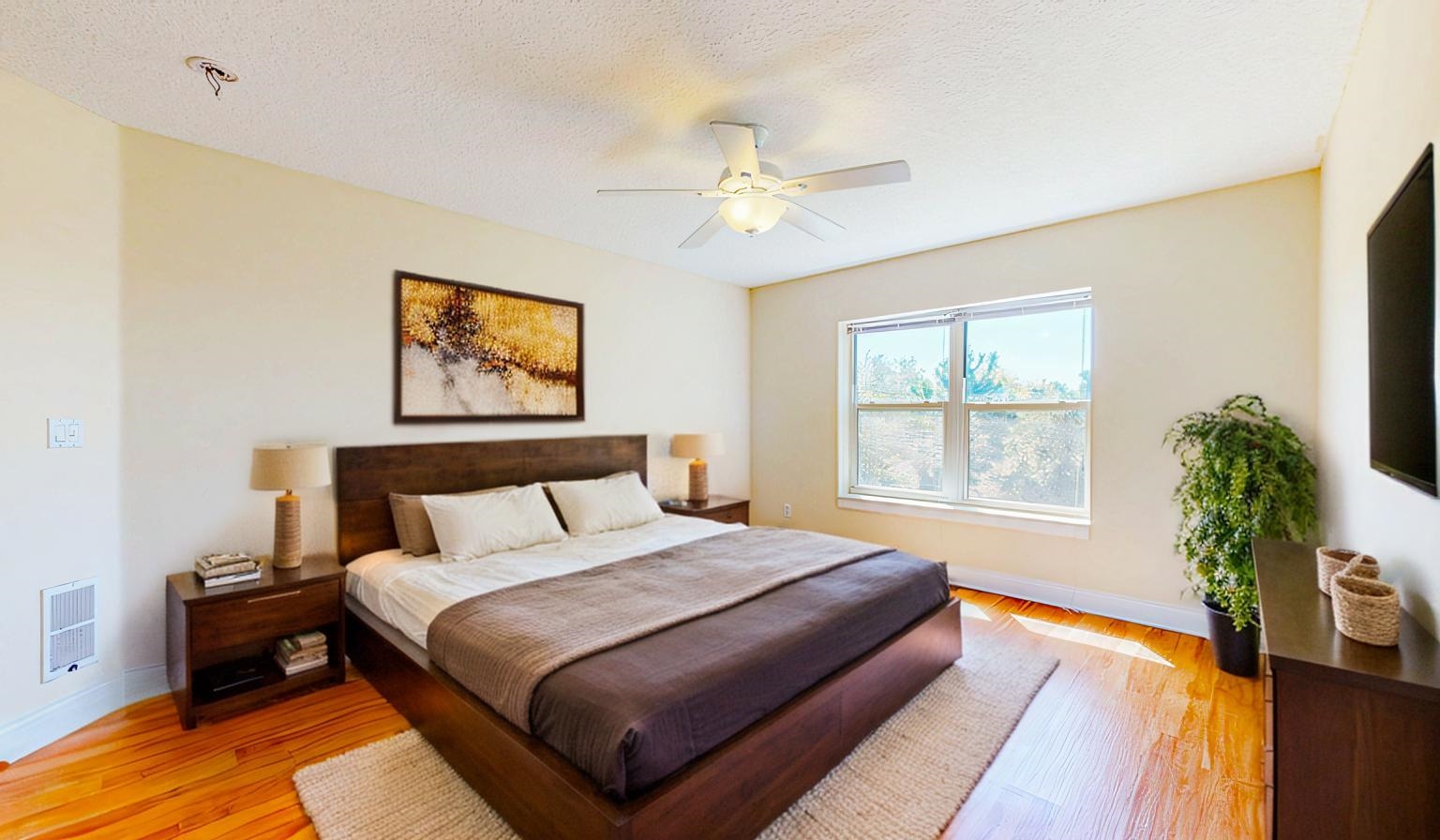 213 Sunset Point St. Augustine, FL 32080 - Photo 23 of 37 a bedroom with bed and a potted plant
