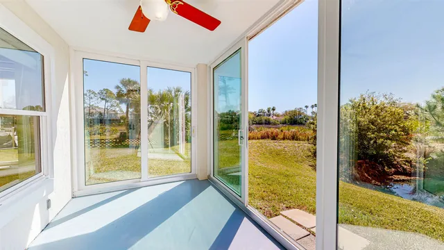 a view of a glass door and a window