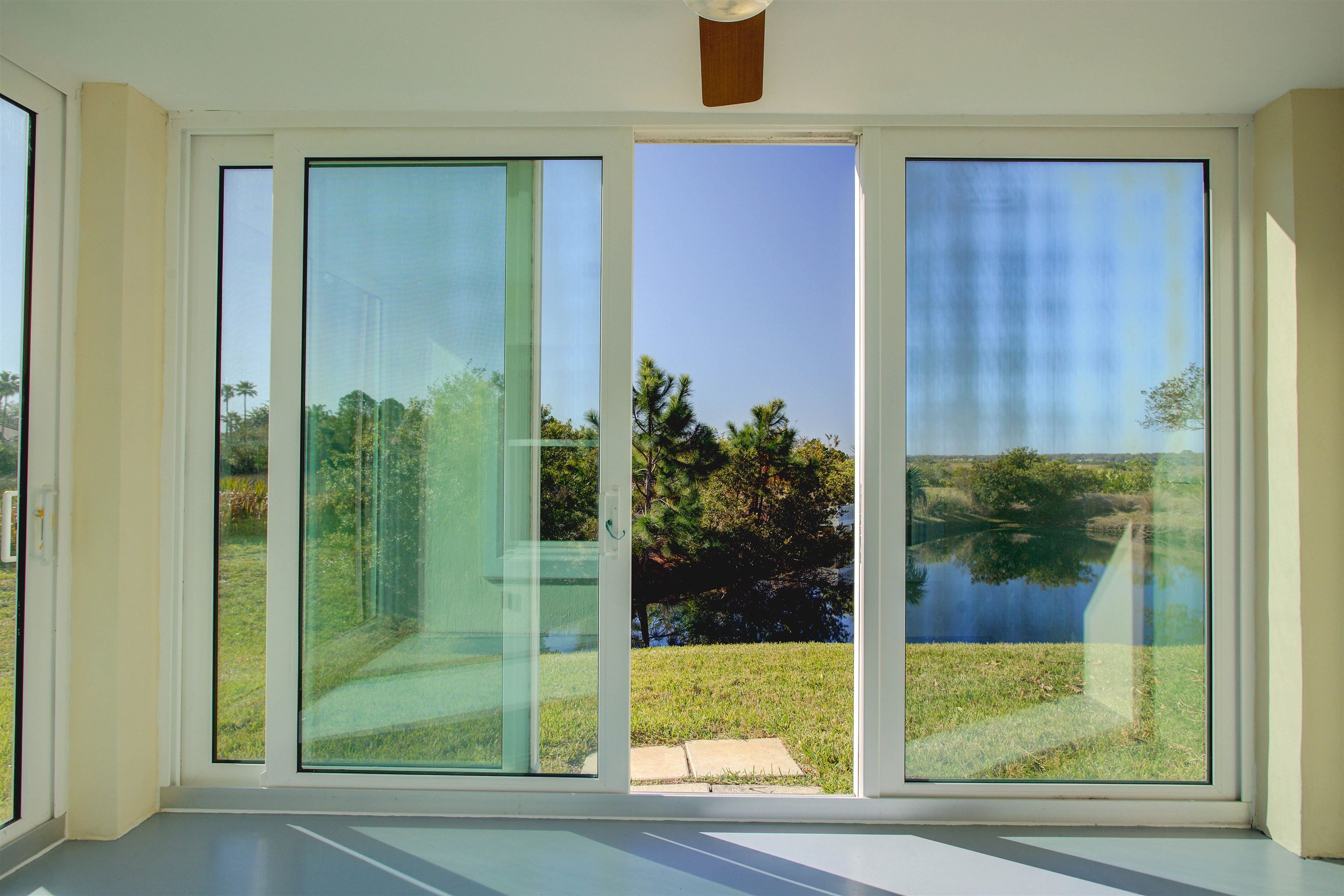 213 Sunset Point St. Augustine, FL 32080 - Photo 25 of 37 a view of a glass door and a window
