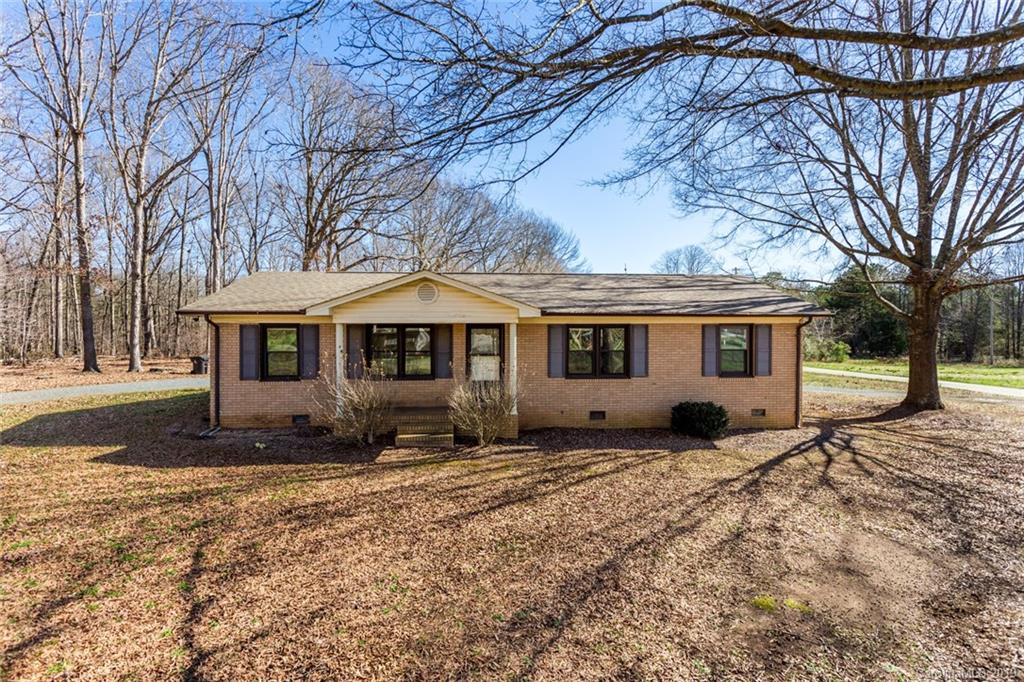 1314 Love Road Monroe, NC 28110 - Photo 1 of 36 a front view of a house with a yard