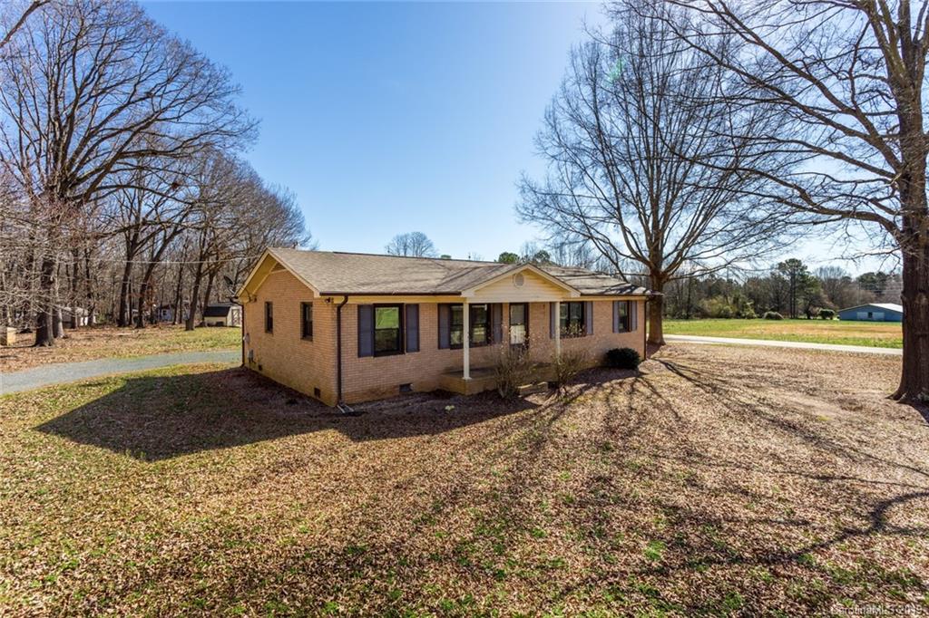 1314 Love Road Monroe, NC 28110 - Photo 2 of 36 a front view of a house with a yard