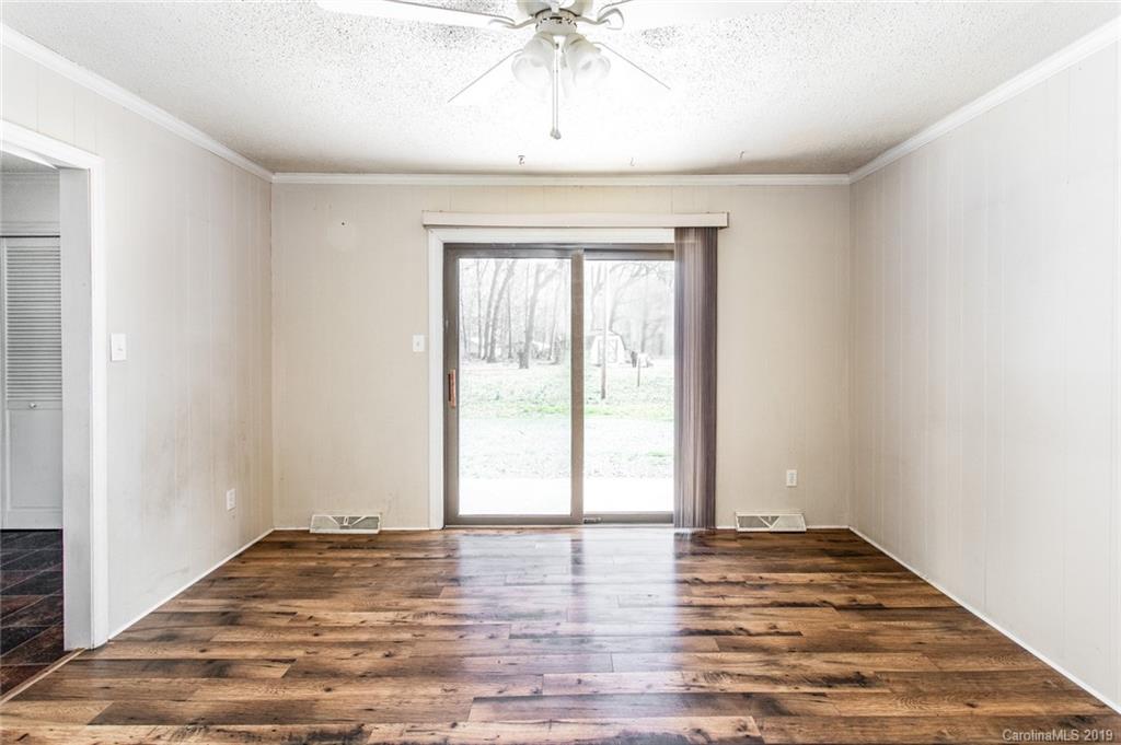 1314 Love Road Monroe, NC 28110 - Photo 12 of 36 a view of empty room with wooden floor and fan