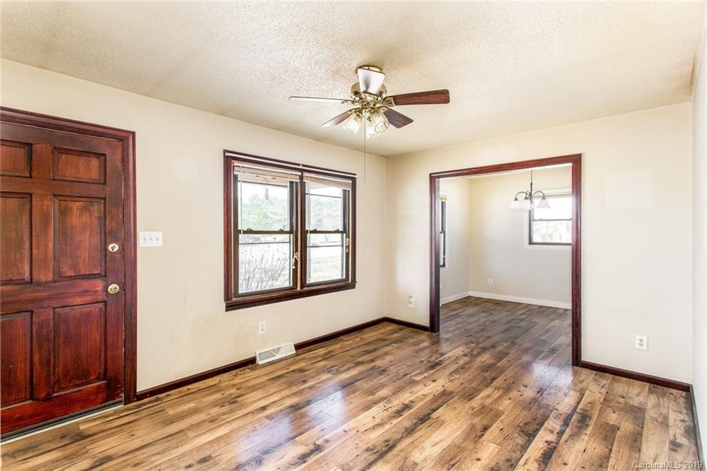 1314 Love Road Monroe, NC 28110 - Photo 13 of 36 wooden floor in an empty room with a window