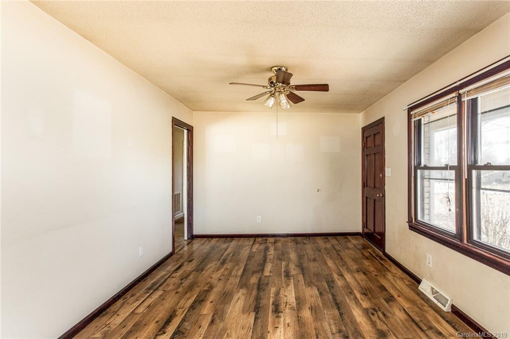 1314 Love Road Monroe, NC 28110 - Photo 17 of 36 a view of empty room with wooden floor and fan