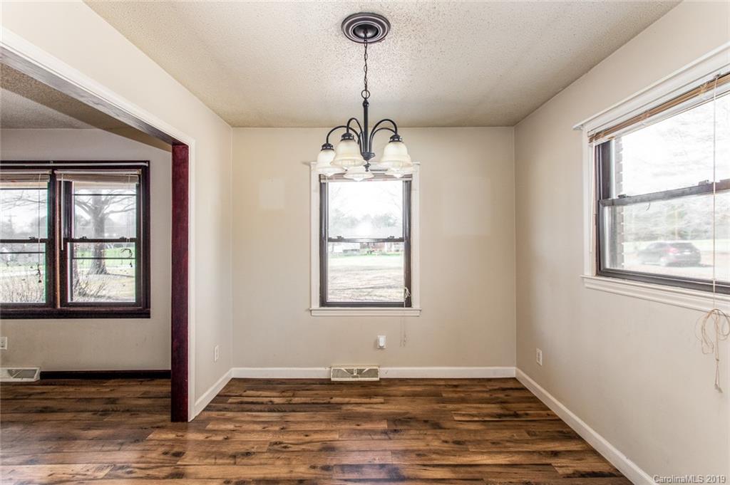 1314 Love Road Monroe, NC 28110 - Photo 18 of 36 a view of an empty room with window and wooden floor