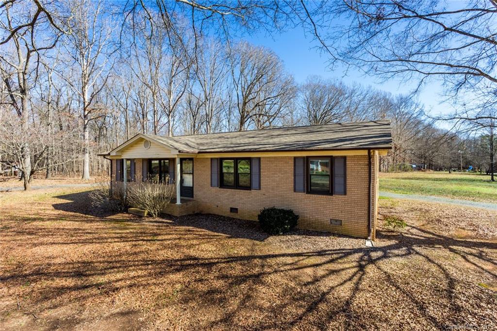 1314 Love Road Monroe, NC 28110 - Photo 3 of 36 a front view of a house with a yard