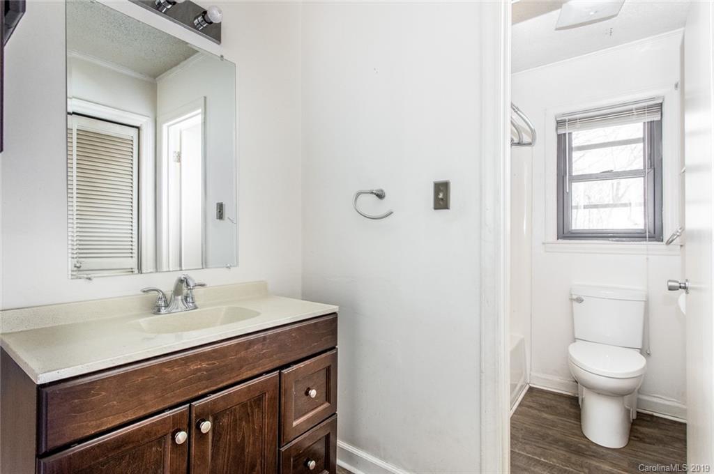 1314 Love Road Monroe, NC 28110 - Photo 27 of 36 a bathroom with a sink toilet and a window