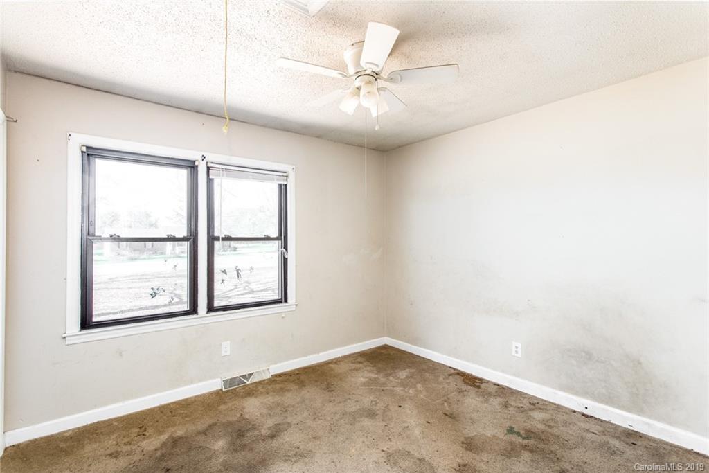 1314 Love Road Monroe, NC 28110 - Photo 28 of 36 an empty room with windows and fan
