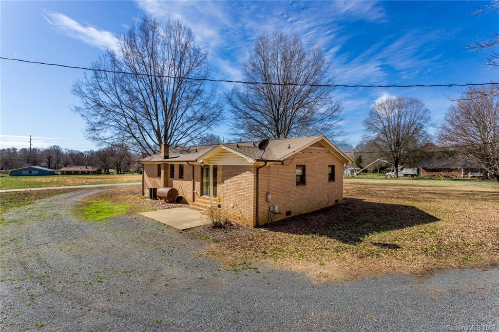 1314 Love Road Monroe, NC 28110 - Photo 4 of 36 a view of a yard with a house