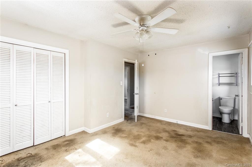 1314 Love Road Monroe, NC 28110 - Photo 31 of 36 a view of a big room with closet and a chandelier fan