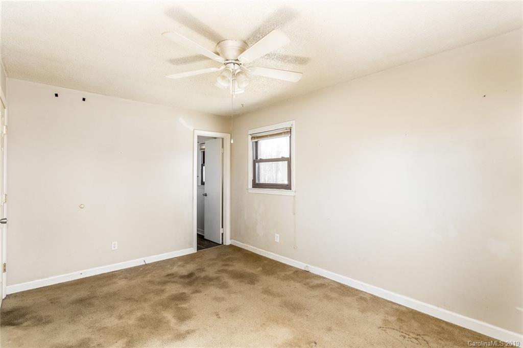 1314 Love Road Monroe, NC 28110 - Photo 32 of 36 an empty room with a window and a fan