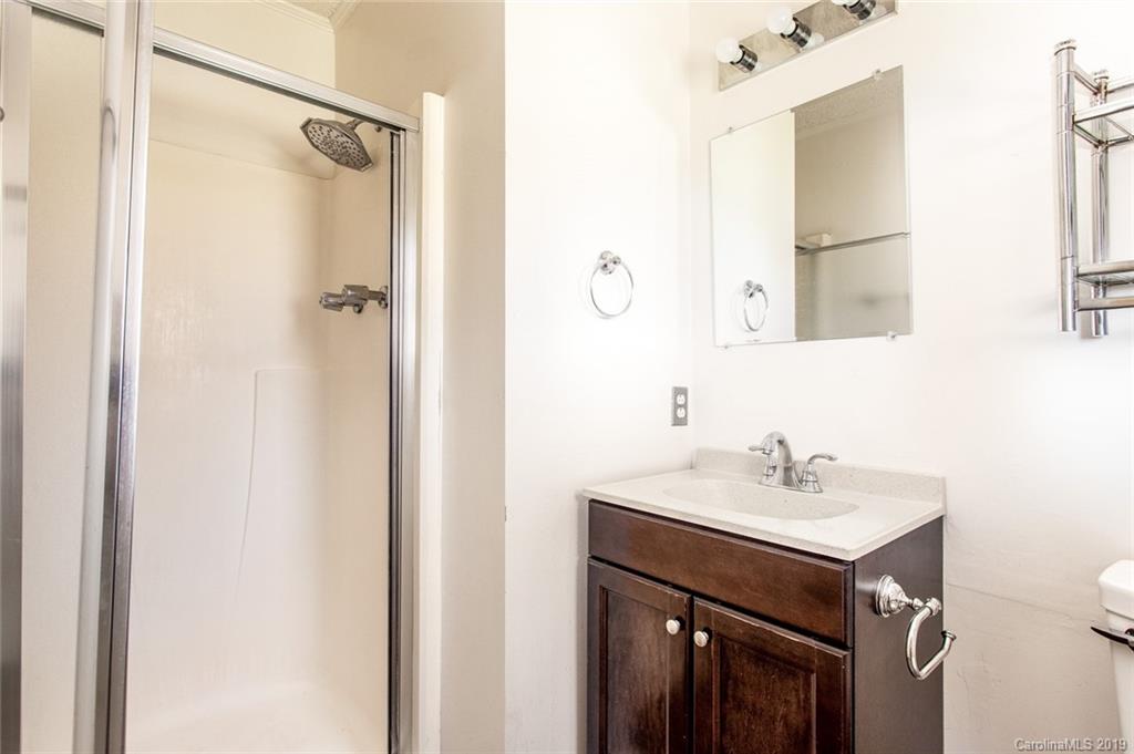 1314 Love Road Monroe, NC 28110 - Photo 33 of 36 a bathroom with a sink and a mirror