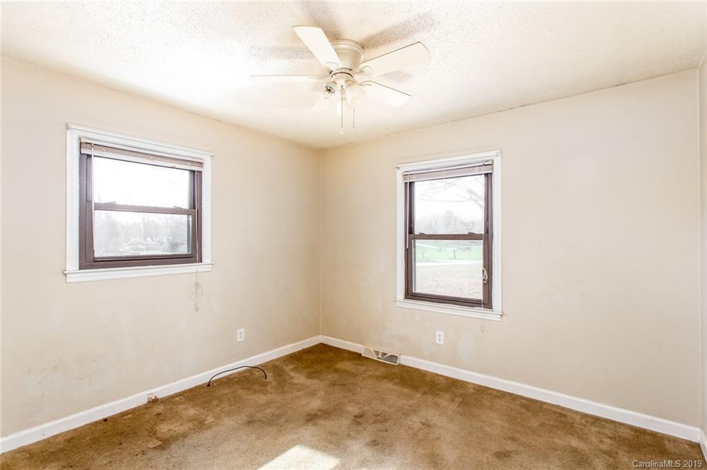 1314 Love Road Monroe, NC 28110 - Photo 34 of 36 an empty room with a window and a fan