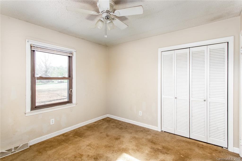 1314 Love Road Monroe, NC 28110 - Photo 36 of 36 an empty room with windows and fan