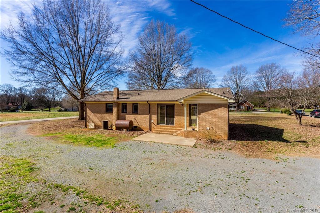 1314 Love Road Monroe, NC 28110 - Photo 5 of 36 a front view of a house with yard and seating area